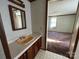 Small bathroom with vanity and mirror at 299 Stikeleather Rd, Hiddenite, NC 28636