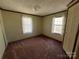 Bright bedroom with carpet flooring and two windows at 299 Stikeleather Rd, Hiddenite, NC 28636