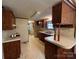 Spacious kitchen featuring wood cabinets and a breakfast bar at 299 Stikeleather Rd, Hiddenite, NC 28636
