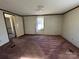 Simple bedroom with carpet and a window at 299 Stikeleather Rd, Hiddenite, NC 28636