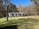 White single-story home on a grassy lot at 299 Stikeleather Rd, Hiddenite, NC 28636