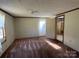 Simple bedroom with carpet and access to bath at 299 Stikeleather Rd, Hiddenite, NC 28636
