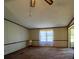 Living room with carpet flooring and a ceiling fan at 299 Stikeleather Rd, Hiddenite, NC 28636