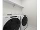 Convenient laundry room with Whirlpool washer and dryer at 3013 Fairview Townes Ct, Charlotte, NC 28210