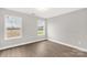 Bright bedroom with two windows and wood-look flooring at 310 Genell Ln, Rock Hill, SC 29730