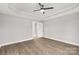 Bright bedroom with wood-look flooring and ceiling fan at 310 Genell Ln, Rock Hill, SC 29730