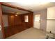 Cozy kitchen features wood paneling, tiled floor, and vintage appliances at 3217 Enfield Rd, Charlotte, NC 28205