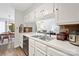 White kitchen with black appliances and ample counter space at 383 Sweetgum Dr, Fort Mill, SC 29715