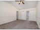 Large bedroom with double closets and ceiling fan at 6558 Regatta Ln, Charlotte, NC 28227