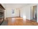 Bright living room with hardwood floors and a fireplace at 6558 Regatta Ln, Charlotte, NC 28227