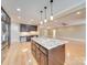 Spacious kitchen island with granite countertop, and hardwood floors at 7919 Concord Hwy, Monroe, NC 28110