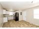 Eat-in kitchen, featuring white cabinets and black appliances at 974 Sylvia Cir, Rock Hill, SC 29730
