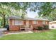Brick ranch home with a well-manicured lawn at 974 Sylvia Cir, Rock Hill, SC 29730