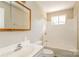 Clean bathroom with a tub and a wood-framed mirror at 974 Sylvia Cir, Rock Hill, SC 29730
