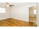 Hardwood floor bedroom with large window and ceiling fan at 974 Sylvia Cir, Rock Hill, SC 29730