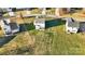 Aerial view of houses on a cul-de-sac with green lawns at 113 Dublin Ct, Statesville, NC 28677