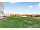 Large backyard with green grass and mature trees at 113 Dublin Ct, Statesville, NC 28677