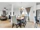 Dining room features a wood table and chairs, adjacent to the living room at 113 Dublin Ct, Statesville, NC 28677