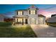 Two-story house with gray accents, double garage, and landscaped lawn at 113 Dublin Ct, Statesville, NC 28677