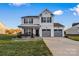 Two-story house with gray accents, double garage, and landscaped lawn at 113 Dublin Ct, Statesville, NC 28677