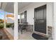 Front porch with brick flooring and wicker chairs at 113 Dublin Ct, Statesville, NC 28677