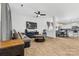 Open living space with hardwood floors, fireplace, and large TV at 113 Dublin Ct, Statesville, NC 28677