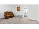 Cozy sitting area with a brown recliner and glass-top coffee table at 113 Dublin Ct, Statesville, NC 28677
