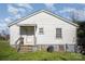 Rear view of a white sided home with steps leading to the back door at 130 E Branch Ave, Shelby, NC 28152