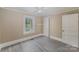 Bright bedroom with wood-look floors and a window at 130 E Branch Ave, Shelby, NC 28152