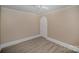 Bedroom with grey flooring and an arched doorway at 130 E Branch Ave, Shelby, NC 28152
