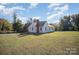 White sided home with a large backyard and driveway at 130 E Branch Ave, Shelby, NC 28152