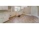 Kitchen area with white cabinets and linoleum floor at 130 E Branch Ave, Shelby, NC 28152