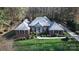 Brick home with a large grassy yard and a paved driveway at 15342 Millview Trace Ln, Mint Hill, NC 28227