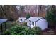 Two storage sheds in a wooded backyard at 15342 Millview Trace Ln, Mint Hill, NC 28227