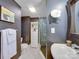 Modern bathroom with dark-grey walls, white vanity, and a glass shower at 225 N Dotger Ave, Charlotte, NC 28207