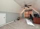 Versatile bonus room with window, ceiling fan, and workspace at 4009 Suttle Pl, Matthews, NC 28104