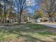 House front with large yard and trees at 6723 Stillmeadow Dr, Charlotte, NC 28277