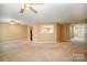 Open living room with a view into the kitchen and access to hallways at 105 Ranlo Ave, Gastonia, NC 28054