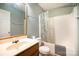 Clean bathroom with tub shower, vanity, and mirror at 105 Ranlo Ave, Gastonia, NC 28054