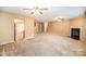 Spacious living room with fireplace and kitchen view at 105 Ranlo Ave, Gastonia, NC 28054