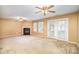 Living room with fireplace, patio doors and neutral color scheme at 105 Ranlo Ave, Gastonia, NC 28054