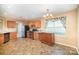 Kitchen with breakfast nook and wood cabinets at 105 Ranlo Ave, Gastonia, NC 28054