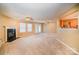 Living room with fireplace, patio doors and neutral color scheme at 105 Ranlo Ave, Gastonia, NC 28054
