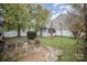 Backyard with shed, trees, and patio at 105 Ranlo Ave, Gastonia, NC 28054