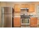 Kitchen with stainless steel range and refrigerator at 105 Ranlo Ave, Gastonia, NC 28054
