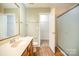 Bathroom with shower, vanity, and linen closet at 105 Ranlo Ave, Gastonia, NC 28054