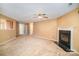 Bright living room with fireplace, access to other rooms, and neutral decor at 105 Ranlo Ave, Gastonia, NC 28054
