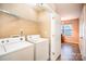 Laundry room with washer, dryer, and additional storage at 105 Ranlo Ave, Gastonia, NC 28054