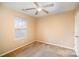 Bright bedroom with neutral walls, ceiling fan, and window blinds at 105 Ranlo Ave, Gastonia, NC 28054