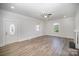 Spacious living room with hardwood floors and a view of the front door and fireplace at 224 Wilson St, Albemarle, NC 28001